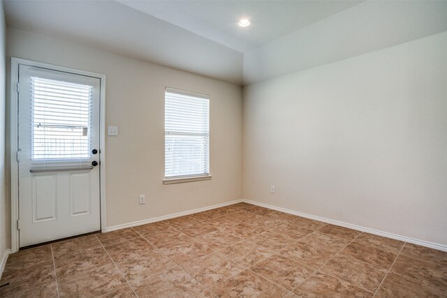 empty room with baseboards