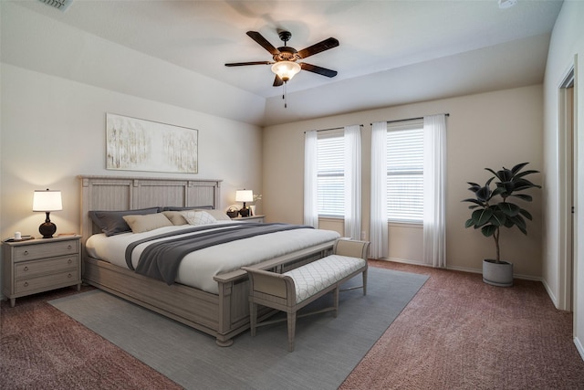 carpeted bedroom with lofted ceiling, ceiling fan, and baseboards