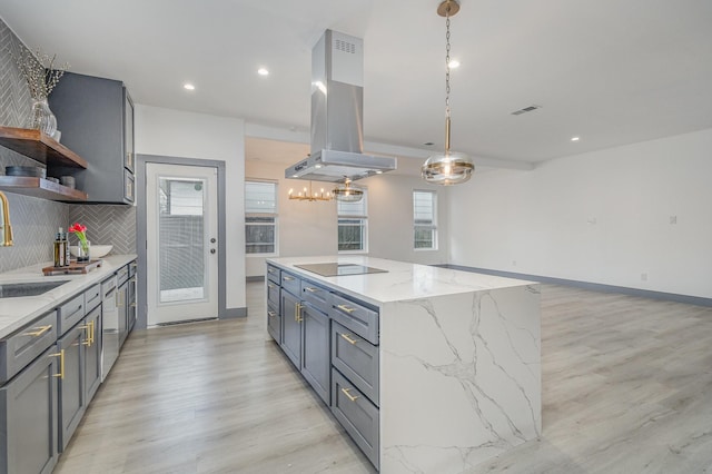 kitchen with tasteful backsplash, a kitchen island, black electric stovetop, island range hood, and open shelves