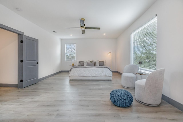 bedroom with recessed lighting, visible vents, baseboards, and wood finished floors