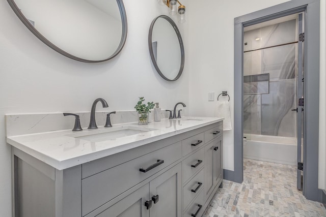 bathroom featuring double vanity,  shower combination, and a sink