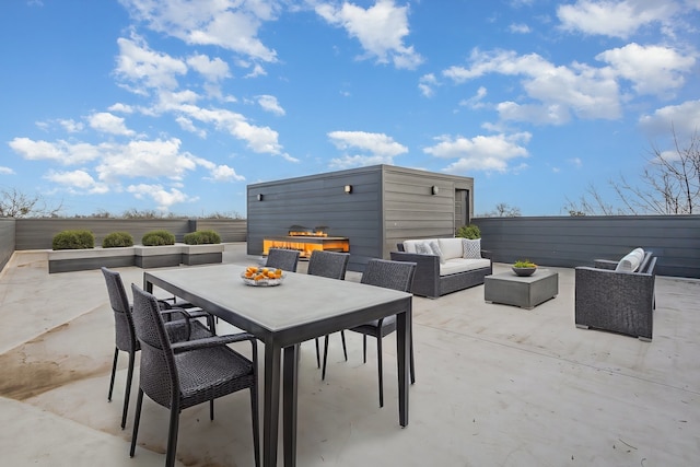 view of patio / terrace featuring outdoor dining space and an outdoor living space