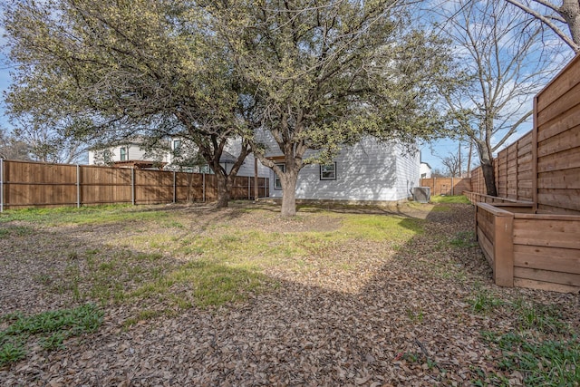 view of yard featuring a fenced backyard