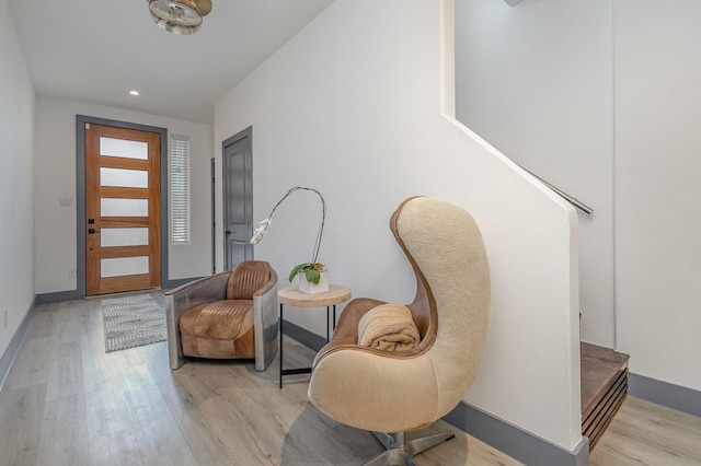 foyer featuring recessed lighting, light wood-style flooring, and baseboards