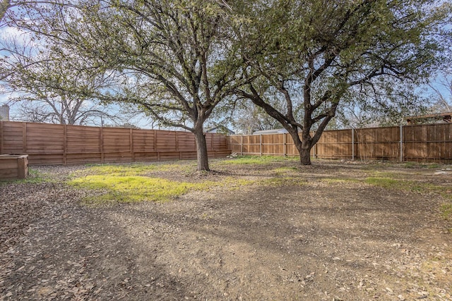 view of yard with a fenced backyard