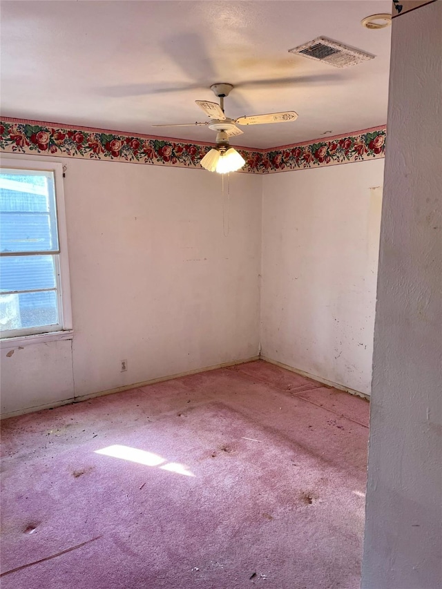 empty room featuring carpet and visible vents