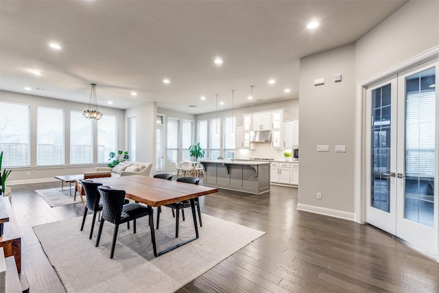 dining area featuring recessed lighting, dark wood-style flooring, and french doors