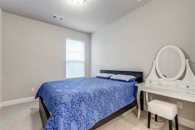 bedroom featuring carpet, visible vents, and baseboards