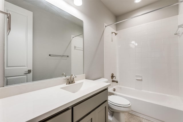 full bath with bathtub / shower combination, vanity, and toilet