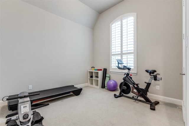 workout room featuring baseboards, carpet flooring, and a healthy amount of sunlight