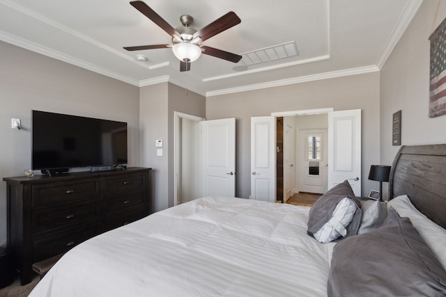 bedroom featuring ceiling fan, visible vents, and crown molding