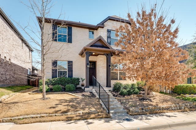 view of front of home with stone siding and brick siding