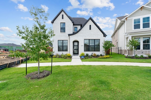 view of front of property with a front yard and fence