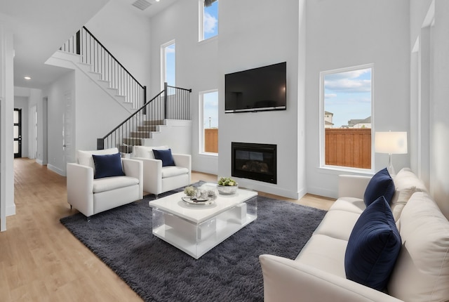 living area with light wood-style floors and plenty of natural light