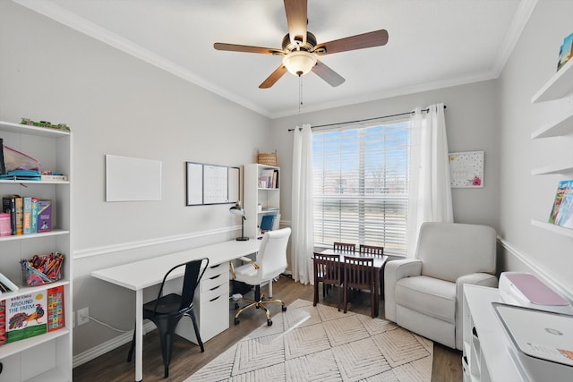 office area with ornamental molding, a ceiling fan, and wood finished floors