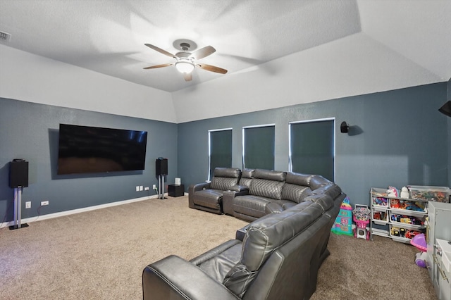 living area featuring carpet floors, lofted ceiling, visible vents, a ceiling fan, and baseboards