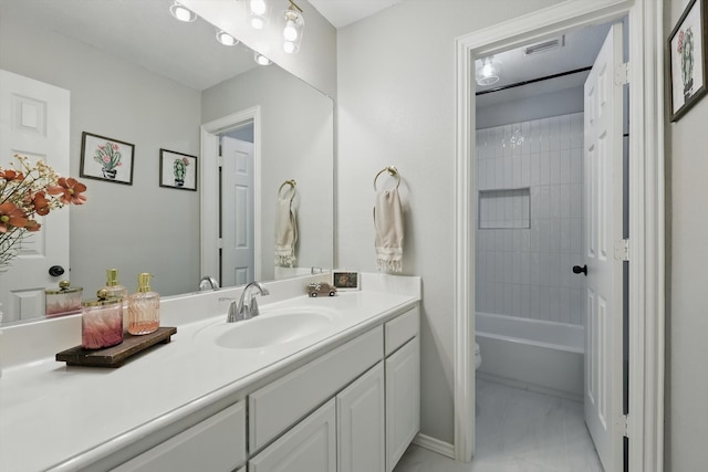 bathroom featuring visible vents, vanity, and toilet