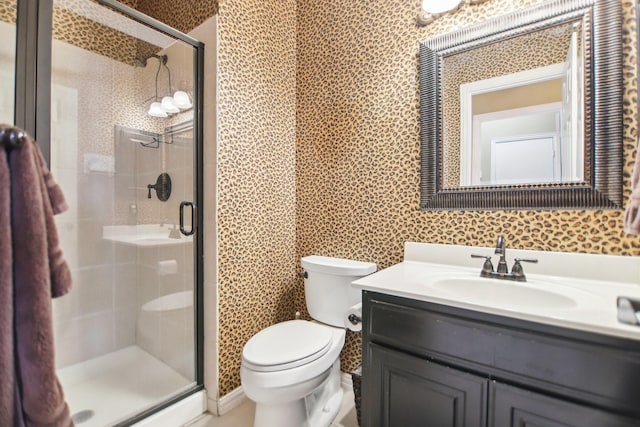 full bath with toilet, a shower stall, and vanity