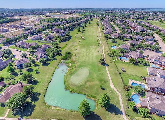 drone / aerial view with a water view and a residential view