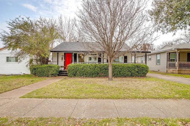 ranch-style house with a porch and a front yard