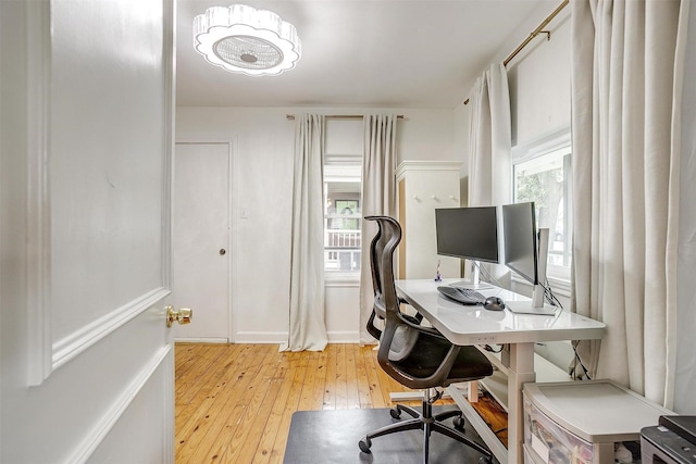 office area with light wood-style flooring