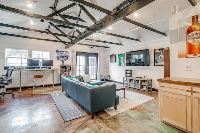 living room with lofted ceiling with beams, recessed lighting, baseboards, french doors, and finished concrete floors