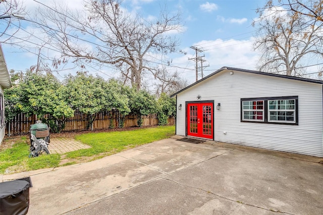exterior space featuring fence private yard and french doors