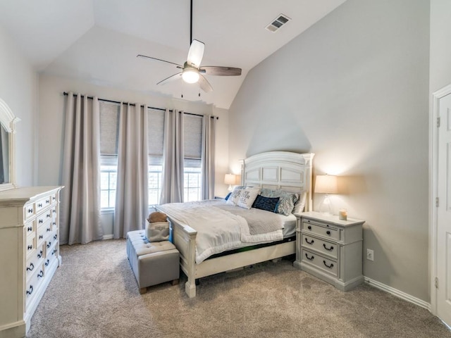 bedroom with lofted ceiling, light carpet, a ceiling fan, visible vents, and baseboards