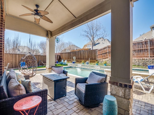 view of patio featuring outdoor lounge area, a fenced backyard, a ceiling fan, and a fenced in pool