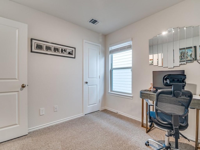 office with baseboards, visible vents, and carpet flooring