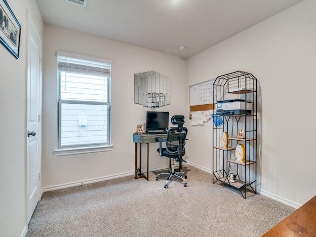 office area featuring carpet and baseboards