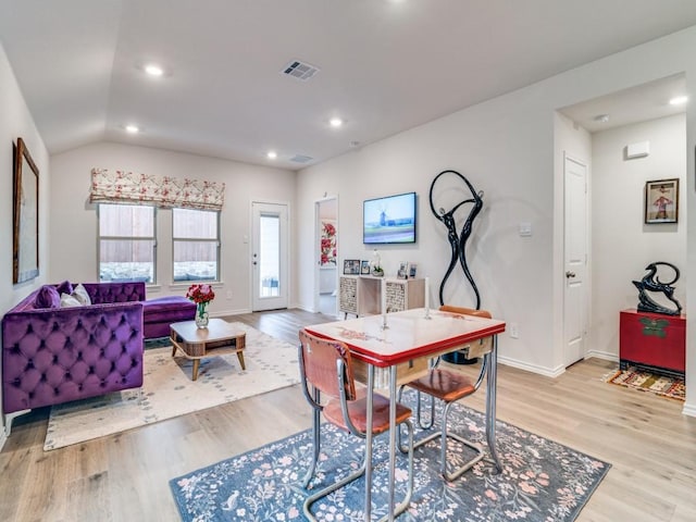 dining space with light wood-style floors, baseboards, visible vents, and recessed lighting