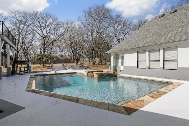 view of pool with stairs, a patio area, and a pool with connected hot tub