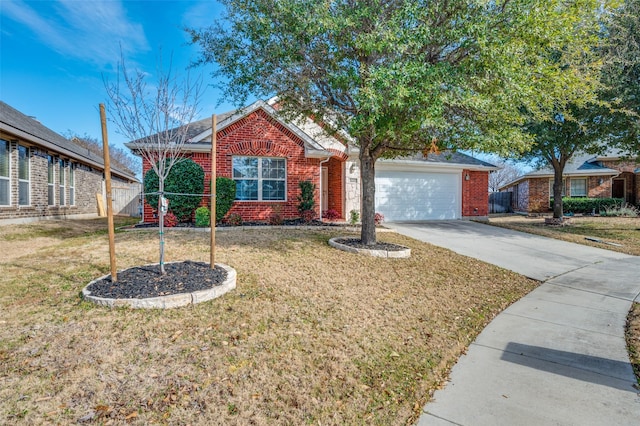 single story home featuring a garage, a front lawn, concrete driveway, and brick siding