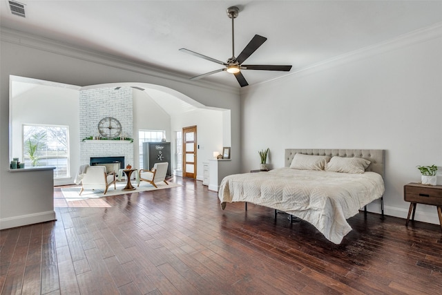 bedroom with dark wood-style floors, visible vents, and crown molding