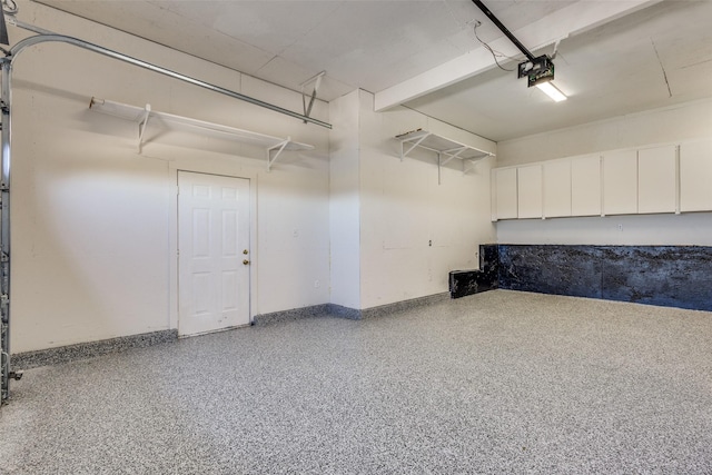 garage featuring baseboards and a garage door opener