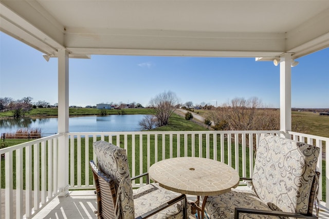 wooden deck featuring a water view