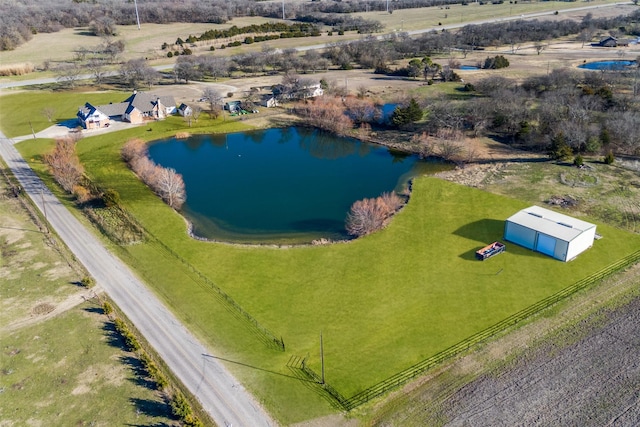 drone / aerial view featuring a water view and a rural view