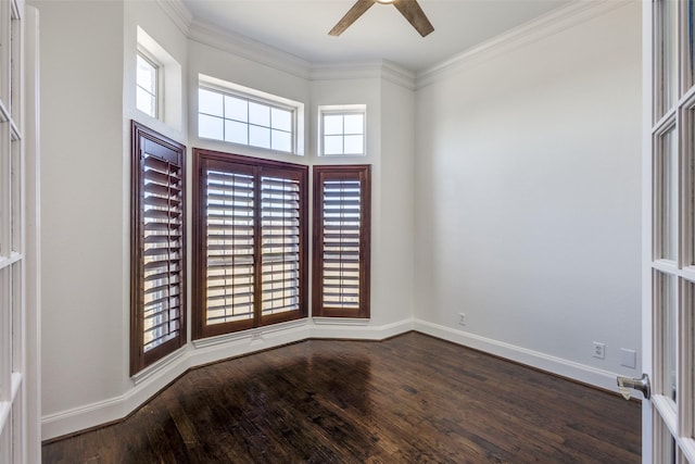 unfurnished room with baseboards, dark wood finished floors, and ornamental molding