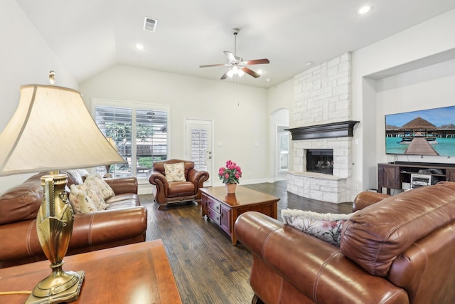 living area featuring dark wood-style floors, a fireplace, lofted ceiling, recessed lighting, and visible vents