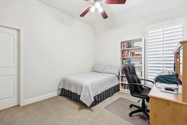 carpeted bedroom featuring ceiling fan and baseboards