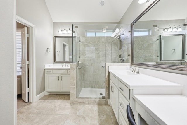 full bathroom with two vanities, a sink, and a shower stall