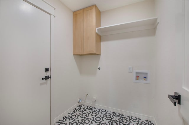 laundry room featuring hookup for a washing machine, cabinet space, gas dryer hookup, electric dryer hookup, and baseboards