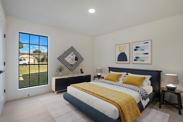 bedroom featuring light wood-style flooring and recessed lighting