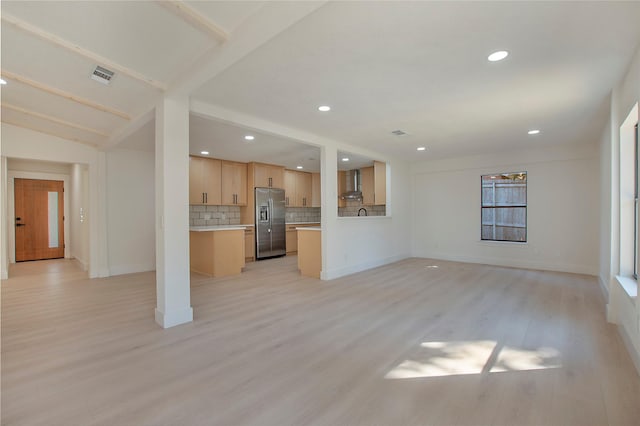 unfurnished living room with baseboards, recessed lighting, visible vents, and light wood-style floors