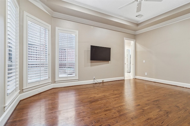 unfurnished living room with a ceiling fan, baseboards, ornamental molding, and wood finished floors