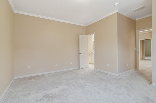 empty room with light carpet, ornamental molding, visible vents, and baseboards