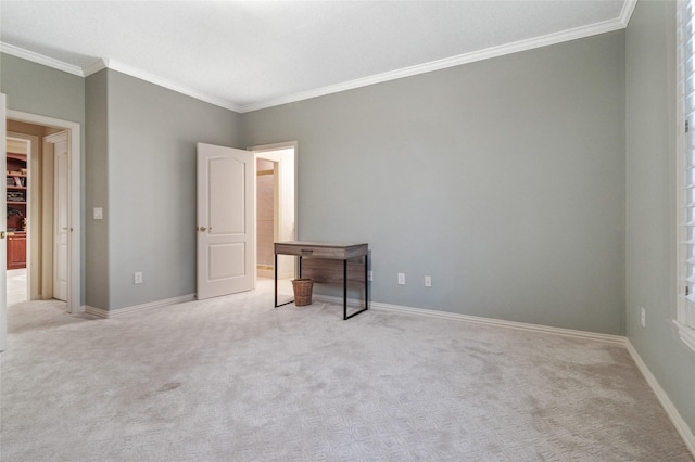 interior space with baseboards, ornamental molding, and light colored carpet