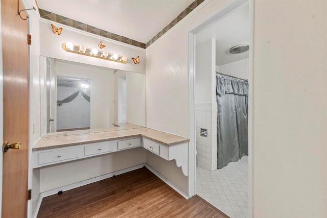 bathroom with vanity, visible vents, wood finished floors, and a shower with shower curtain