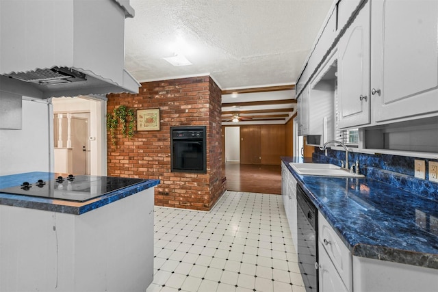 kitchen featuring black dishwasher, dark countertops, brick wall, light floors, and a sink